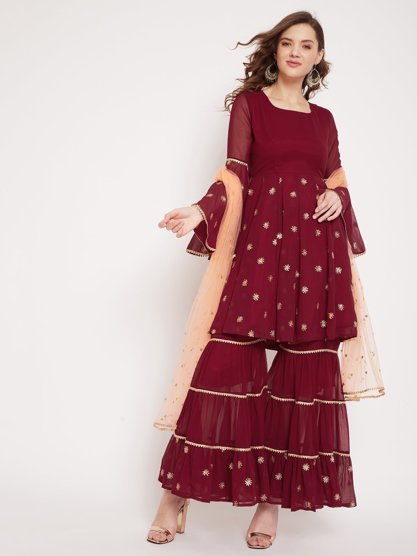 Maroon sharara set with peach dupatta, overall gota lace detailing