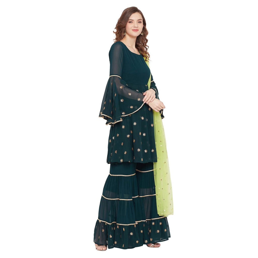 Dark green sharara set with green dupatta, overall gota lace detailing