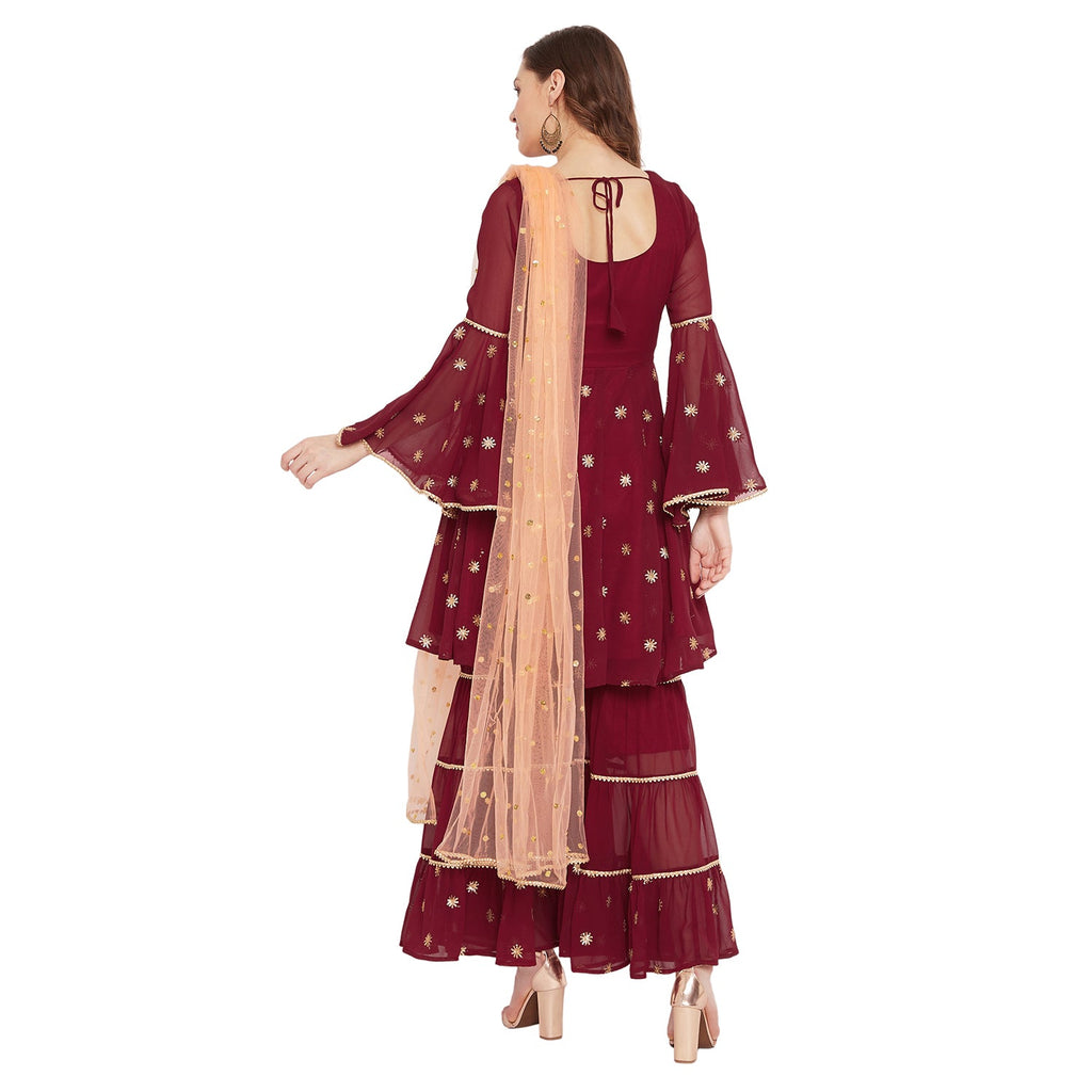 Maroon sharara set with peach dupatta, overall gota lace detailing