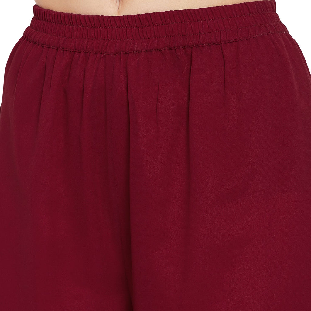 Maroon jaal embroidered kurta and sharara with peach dupatta